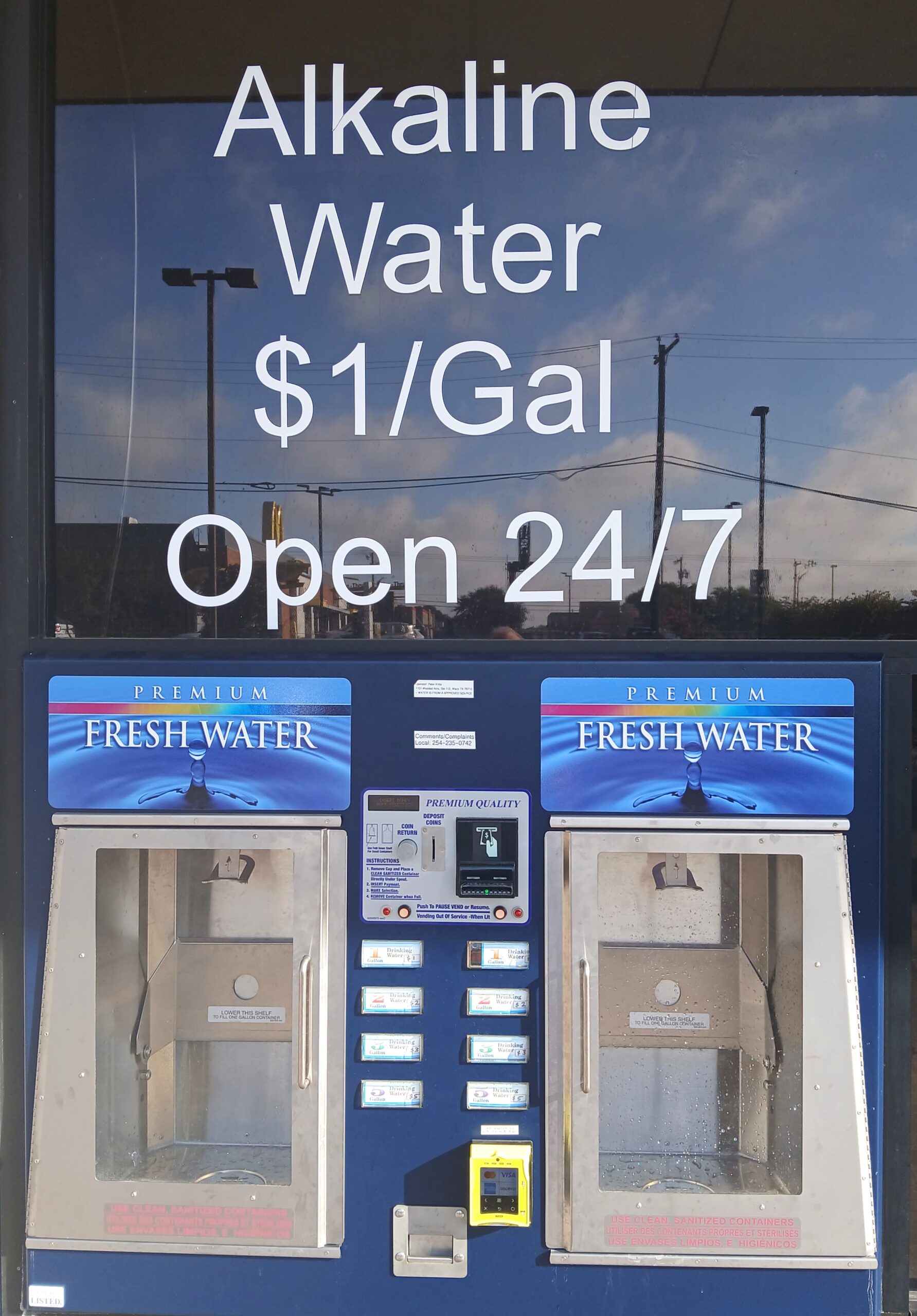 Customers using the Blue Jug alkaline water refill station in Waco for eco-friendly hydration.